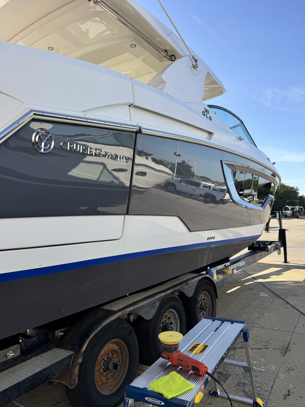 Machine polishing a Cruisers Yachts 38 GLS as part of paint correction
