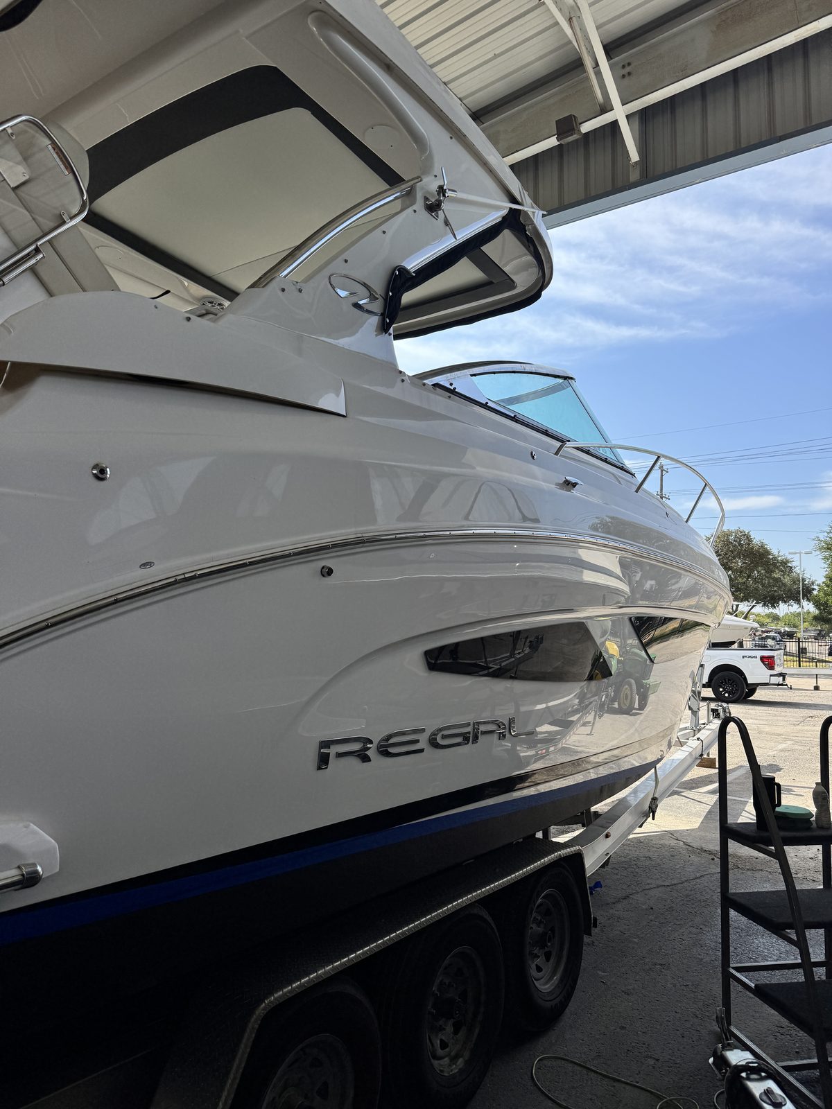 Regal cruiser bow after paint correction and ceramic coating